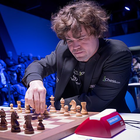 Magnus Carlsen and Magnus Chess Academy. Magnus Carlsen wearing his chess.com jacket.