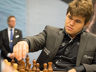 Magnus Carlsen at the chessboard playing chess.
