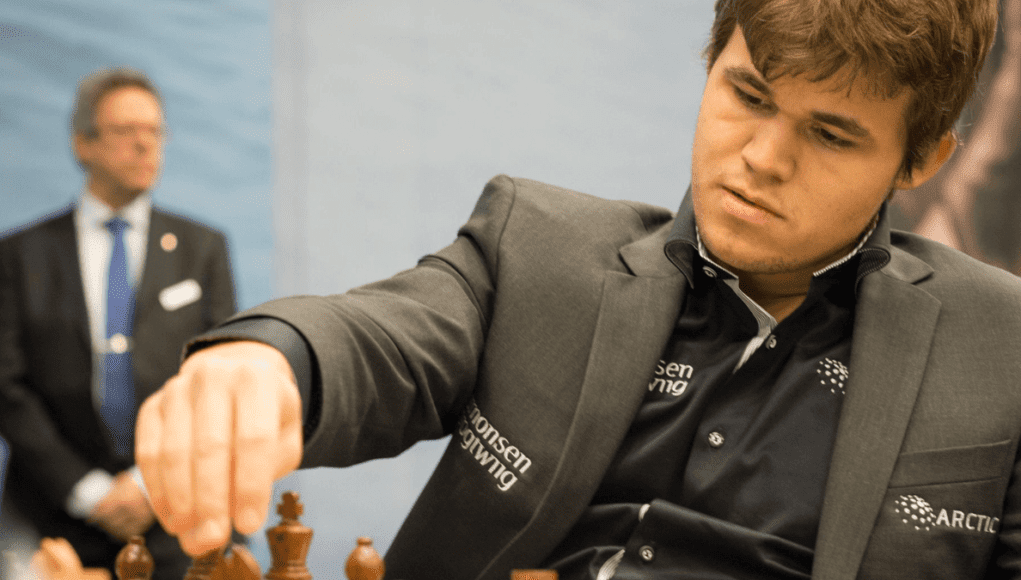 Magnus Chess Academcy and Magnus Carlsen playing chess.